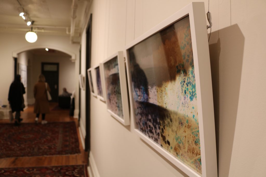 A series of photographs hanging in a hallway