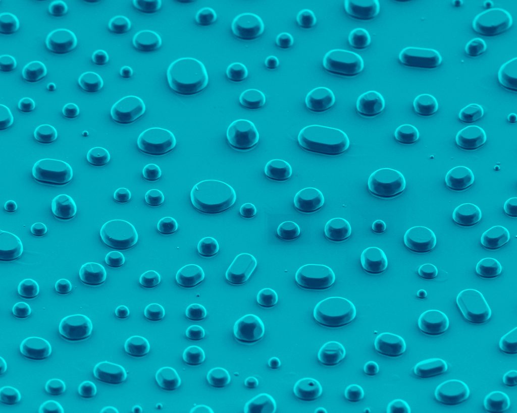 Vibrant blue polkadots. Raindrops: Nickel particles agglomerated on an yttrium-stabilized zirconia substrate – from Labscapes