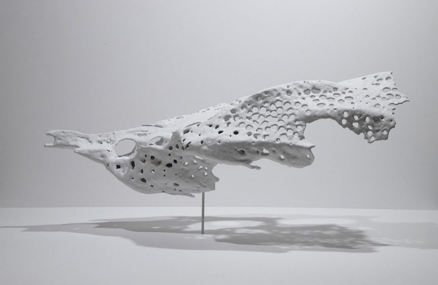 science art sculpture: a white fragment suspended in the air