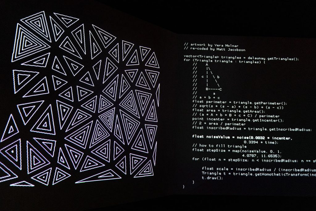 The left panel contains many triangles in a pattern, and the right panel contains the code that made the pattern. 