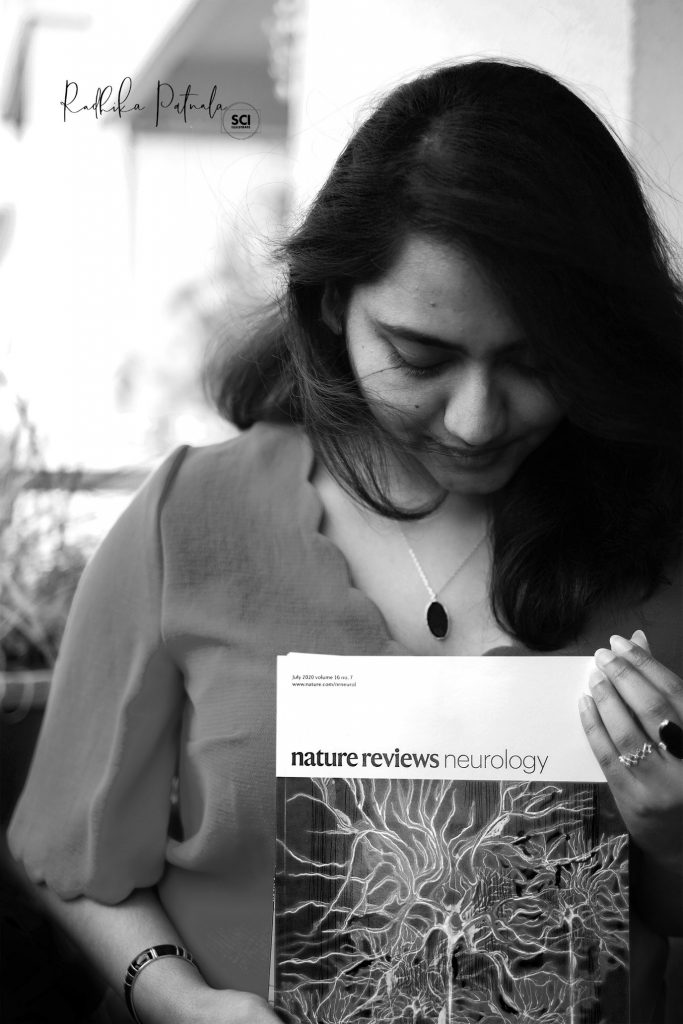 Dr Radhika Patnala holding her Nature journal.