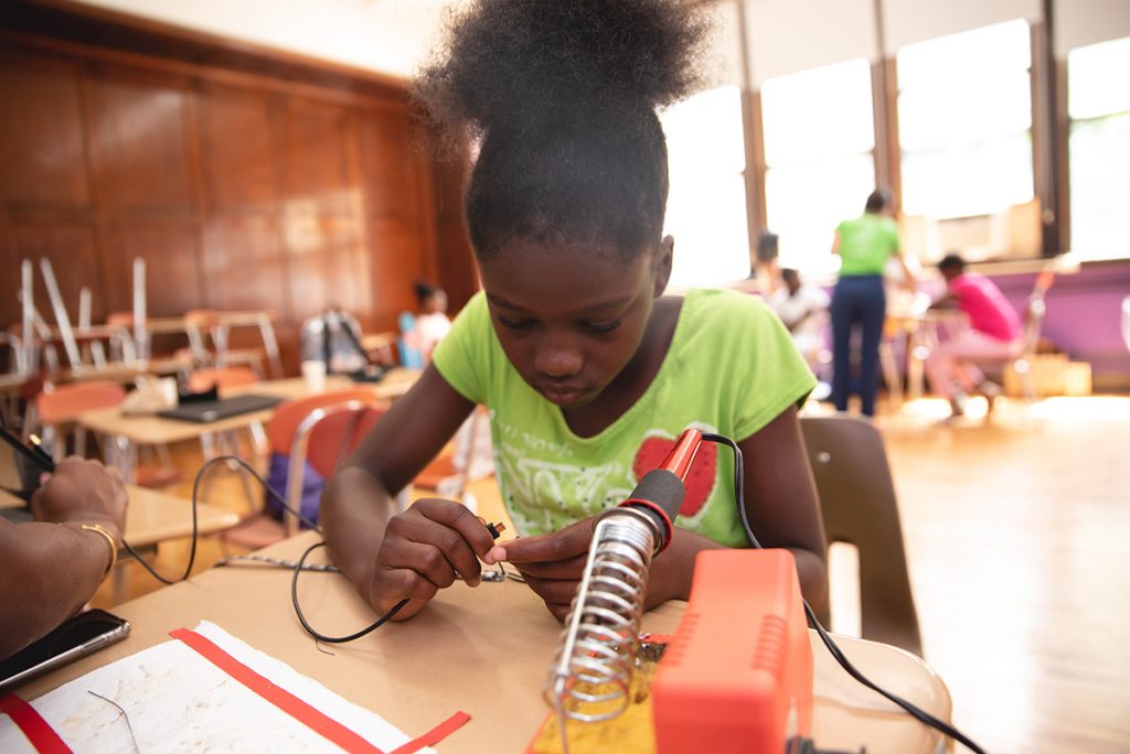 Girl working with circuits