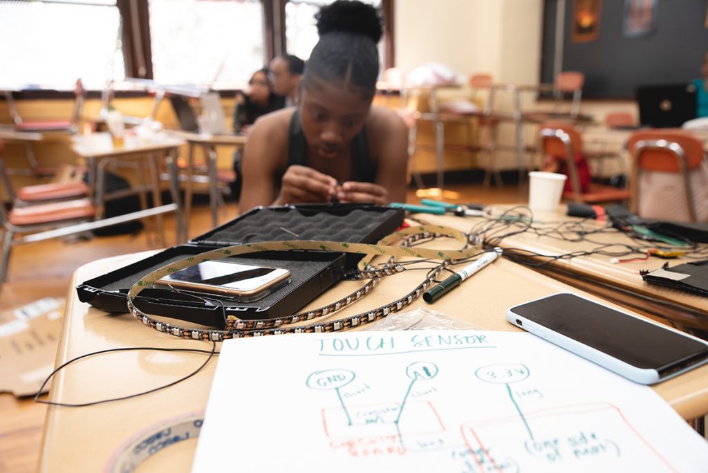 Girl working with circuits