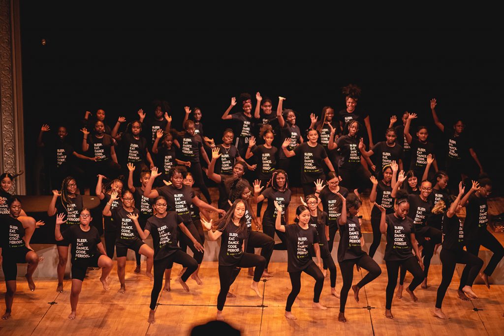 Girls dancing on stage wearing all black