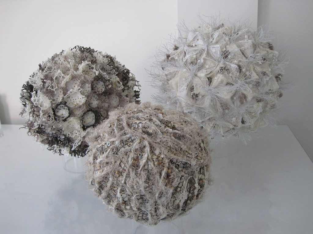 Three spheres with covered with fabrics to create different textures